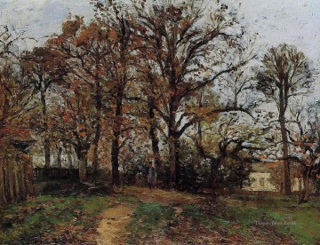  1872 Arte - Árboles en una colina paisaje otoñal en Louveciennes 1872 Camille Pissarro